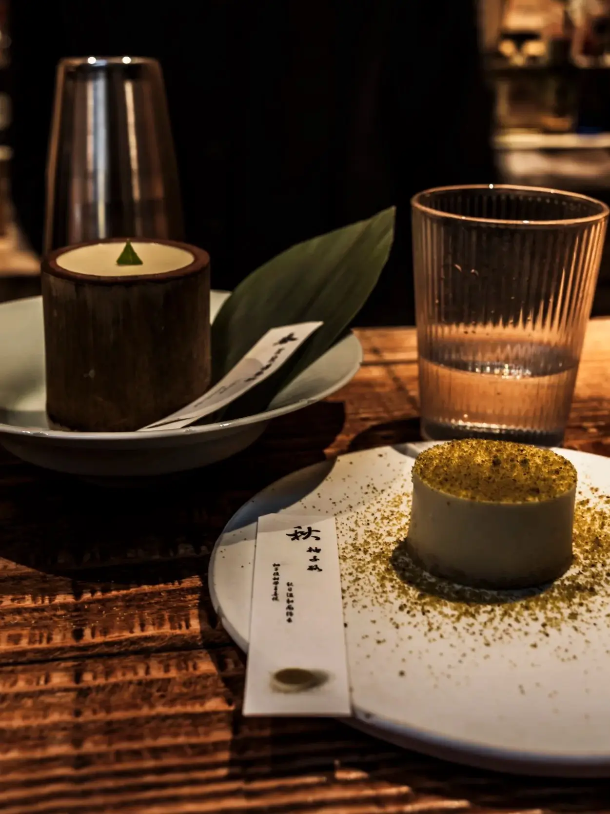 Elegant dessert and tea set in a modern Chinese teahouse with soft lighting and minimalist presentat
