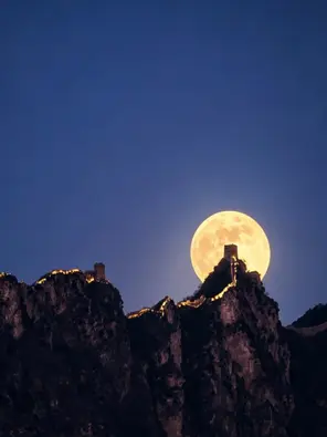 Simatai Great Wall full moon night view during a BiteEscape Beijing private tour, showcasing the Wall under a dramatic moonlit sky