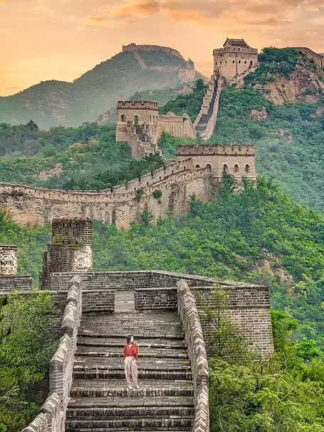 Traveler exploring Jinshanling Great Wall during a BiteEscape Beijing private tour, showcasing original watchtowers and scenic mountain views