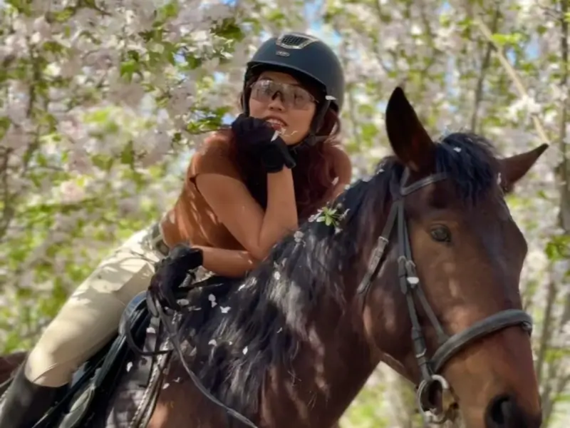 Lin with a horse in a quiet forest near Beijing.