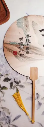 Finished lacquer fan with Chinese calligraphy, created in a BiteEscape cultural experience.