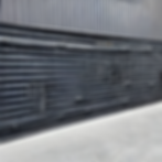 metal wall with rivets and concrete floor-1675283076947.jpg