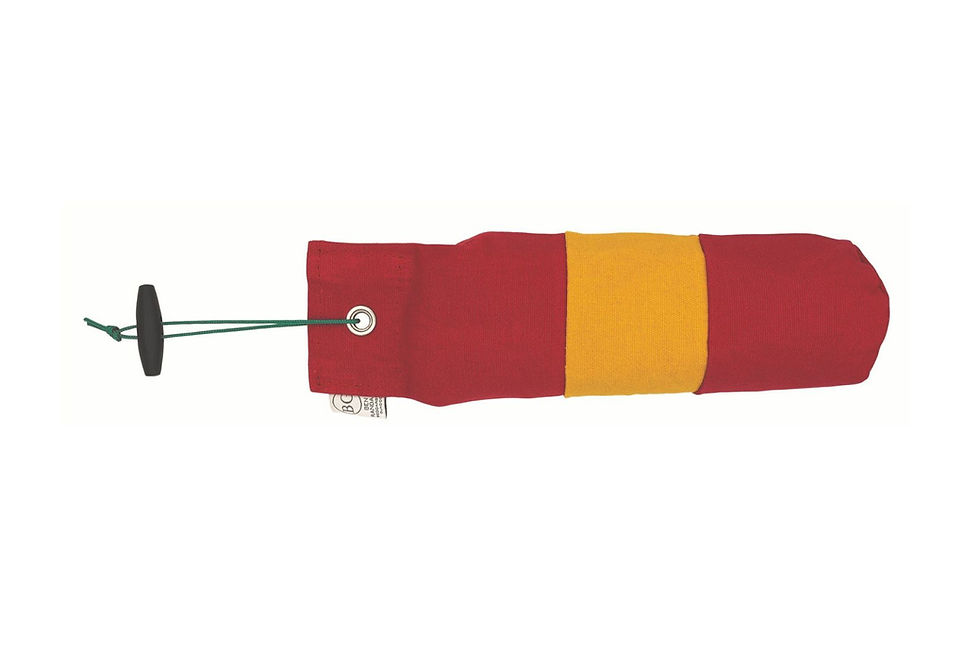The BG True Centre Hold Dummy which is red at either end and has a yellow section round the middle. It is shown against a white background.