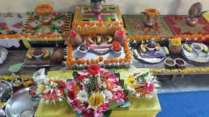 Ceremonial offerings with flowers and decorated pots