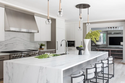 Custom white oak flooring in luxury marble kitchen design