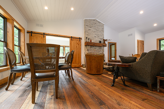 Antique heart pine original face flooring in open plan living and dining space