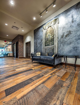 Antique reclaimed hit-skip oak solid flooring site finished with oil polyurethane in commercial interior