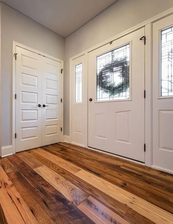 Thumbnail: Luxury residential hallway featuring a professional installation of Antique Reclaimed Oak Hit-Skip floors.