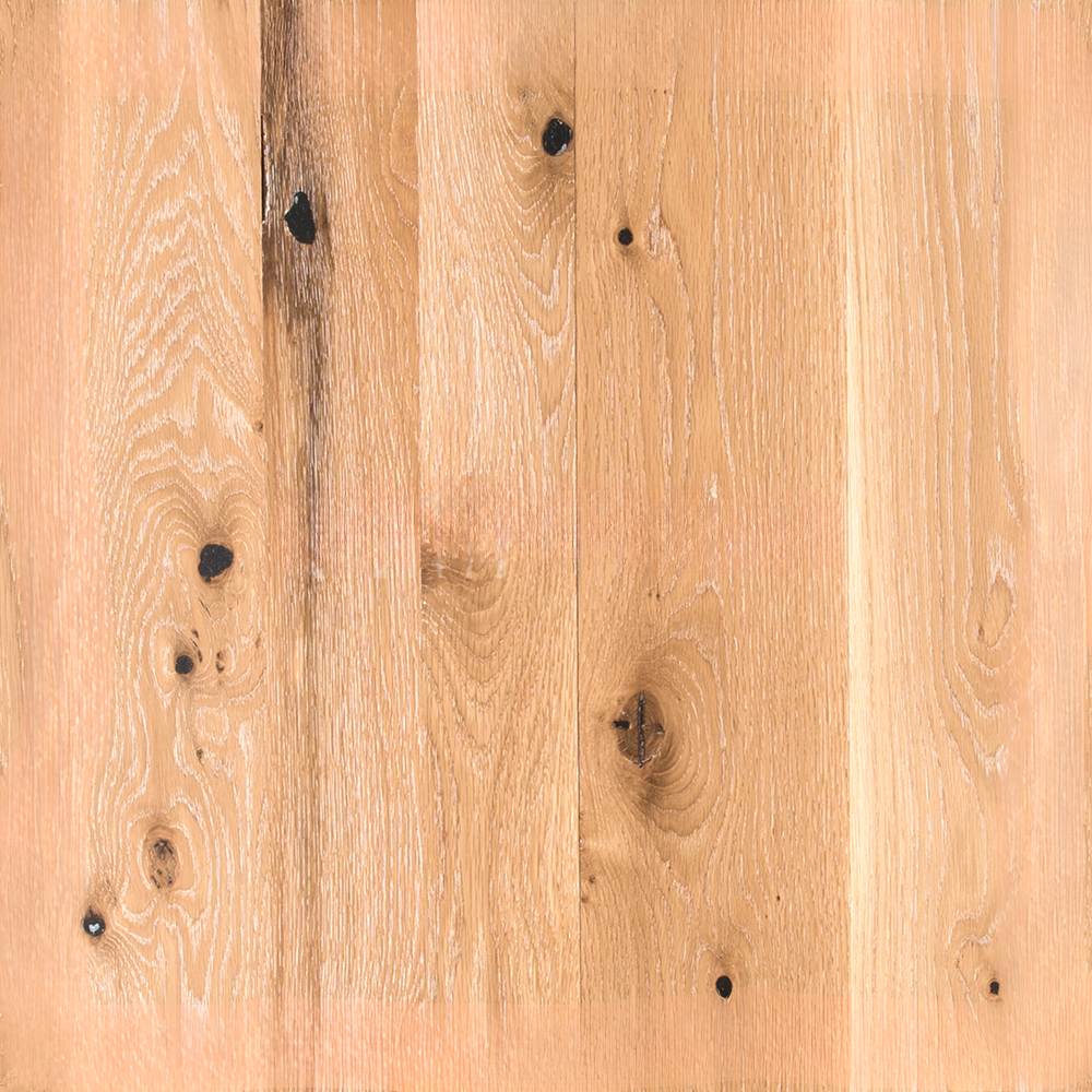 Honey wide plank flooring with visible grain movement and natural wood texture