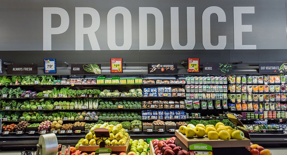 Grocery store shelves filled with produce.