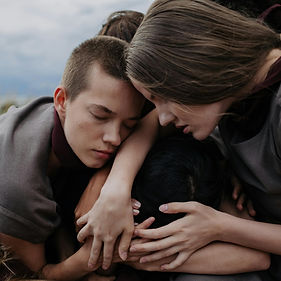 A group of people supporting someone in need.