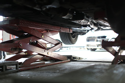 Car lifted on a lift for repair in a car service