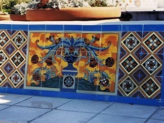 Colorful tile mosaic with detailed vase and floral design