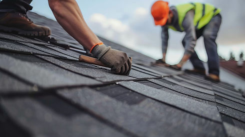 Workers installing new shingles for roof repair