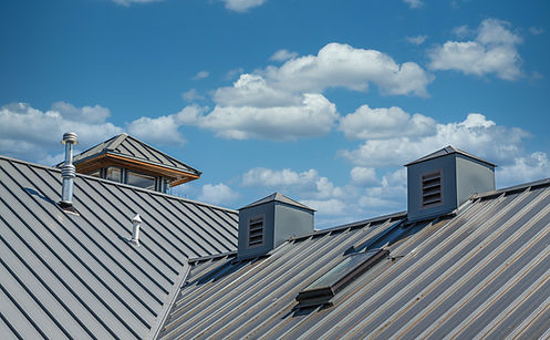 Corrugated steel roof with vents and cupola