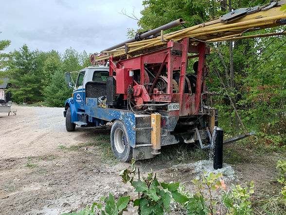 Well drilling truck with a new well casing