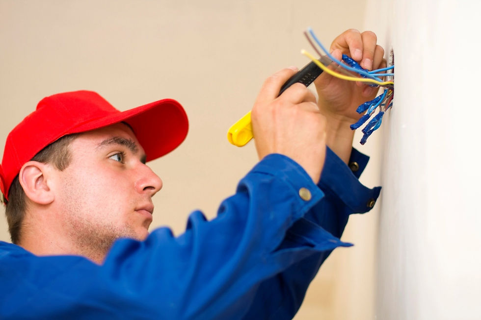 A technician installing electricity in a new house.