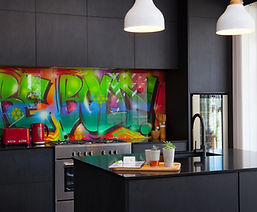 Vibrant graffiti wall art in modern kitchen