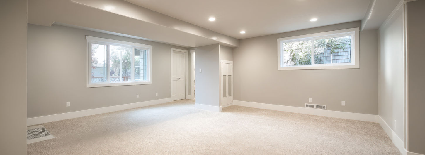 Finished basement room with windows