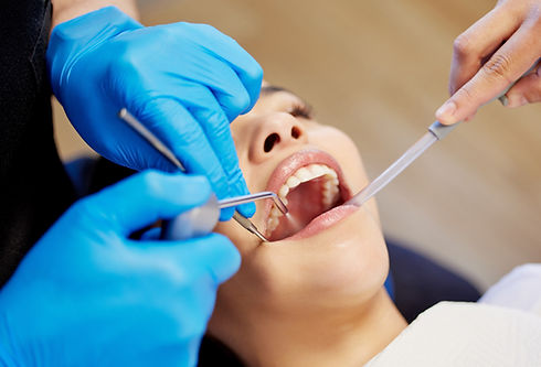a young woman having a dental procedure performed on her