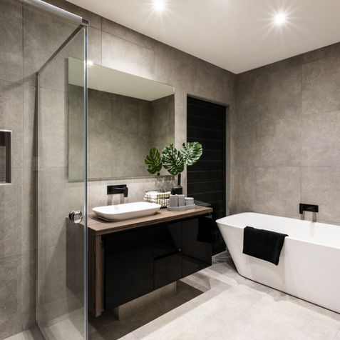 Modern bathroom with walk-in shower, vanity, and freestanding tub