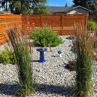 Landscaped garden project with gravel and wooden fence