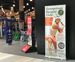 Georgetown Racquet Club banner with a tennis player