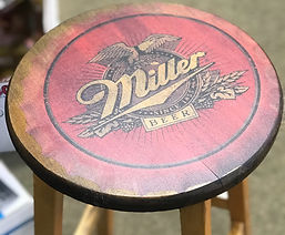 Wooden bar stool with Miller Genuine Draft Beer logo