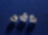 Three sparkling heart-shaped diamonds