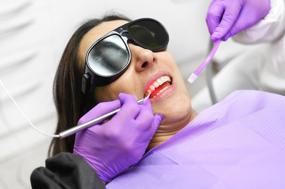 Dental team preparing for a minimally invasive gum treatment around a dental implant in a clinic setting.