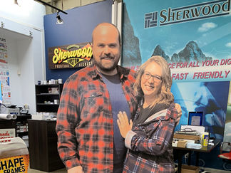 Cardboard cutout of a man and woman in plaid shirts