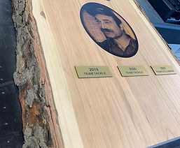 Live edge wooden memorial plaque with engraved portrait and text