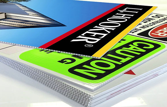 Corrugated signs with 'L.J. HOOKER' and 'CAUTION'