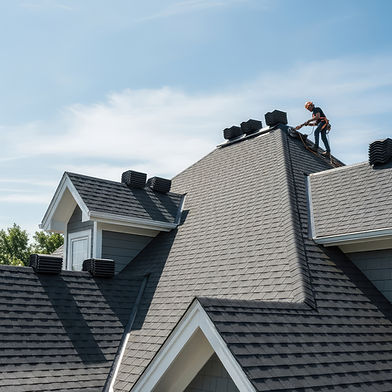 Roofer installing new shingles on a residential roof
