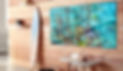 Surfboard and triptych artwork of person snorkeling in coral reef