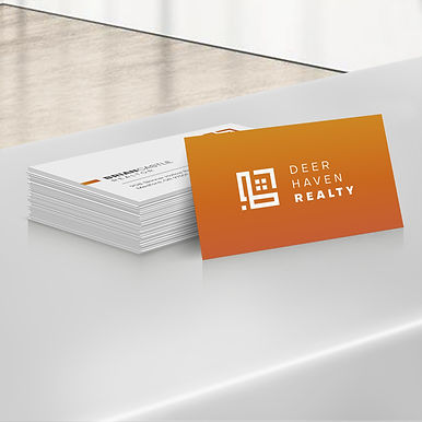 Stack of Deer Haven Realty business cards