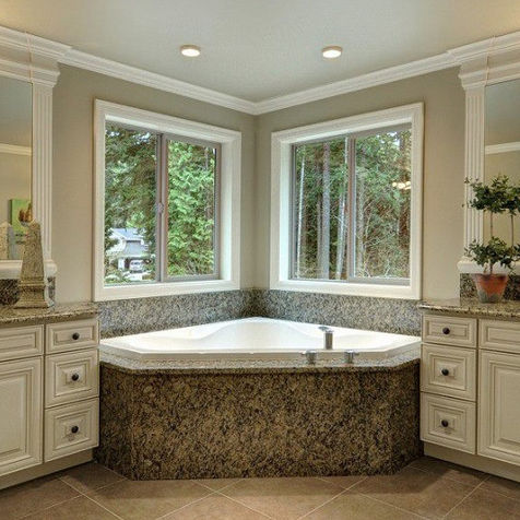 Bathroom renovation with corner tub, dual vanities