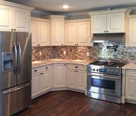 White kitchen cabinets, granite counters, stainless appliances