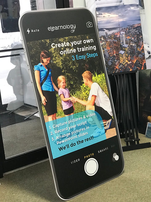 Signage shaped like a smartphone displaying online training