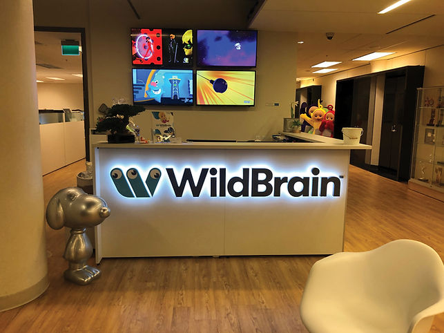 WildBrain office reception with logo and screens