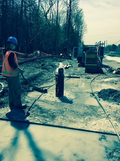 Worker performing well pump repair