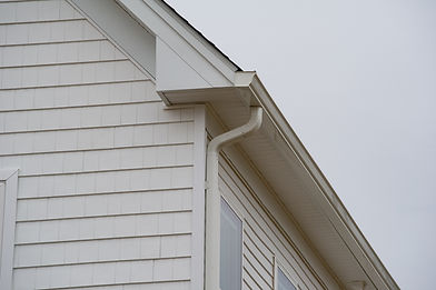 White horizontal lap siding on a residential home exterior.