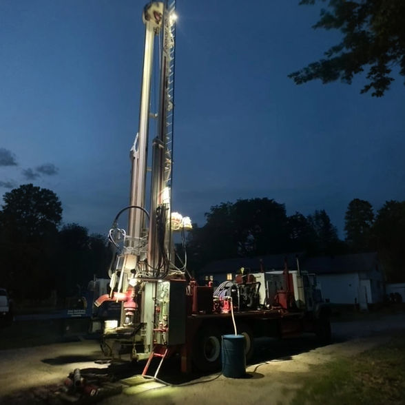 Drilling rig illuminated at night