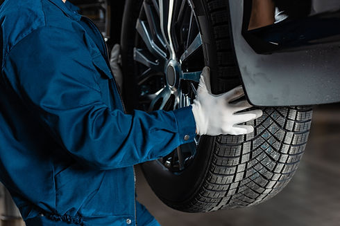 Mechanic installing a car tire
