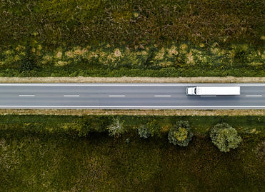 Aerial view of a white truck on a highway
