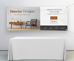 Trade show banner: Interior Designs & Home Styles, with table