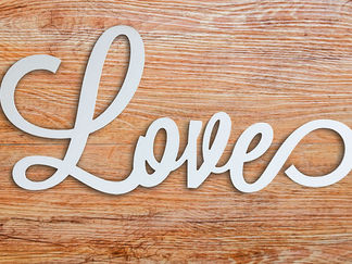 Decorative word Love on wood