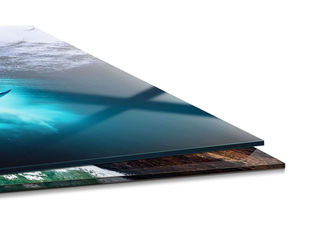 Stacked prints, top one glossy with ocean scene