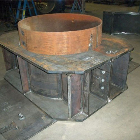 Large industrial steel fabrication base with a circular ring