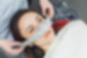 dentist puts inhalation sedative mask on his patient